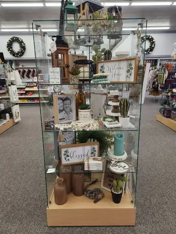 Gift shop shelves stocked with cards, candles and seasonal gifts
